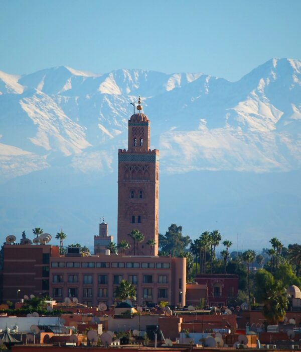 brown concrete building near mountain during daytime
