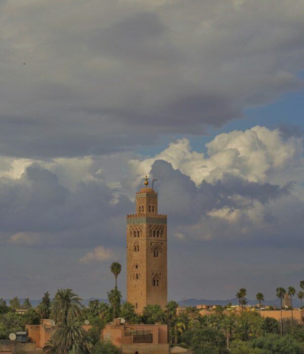A tall tower with a clock on the top of it